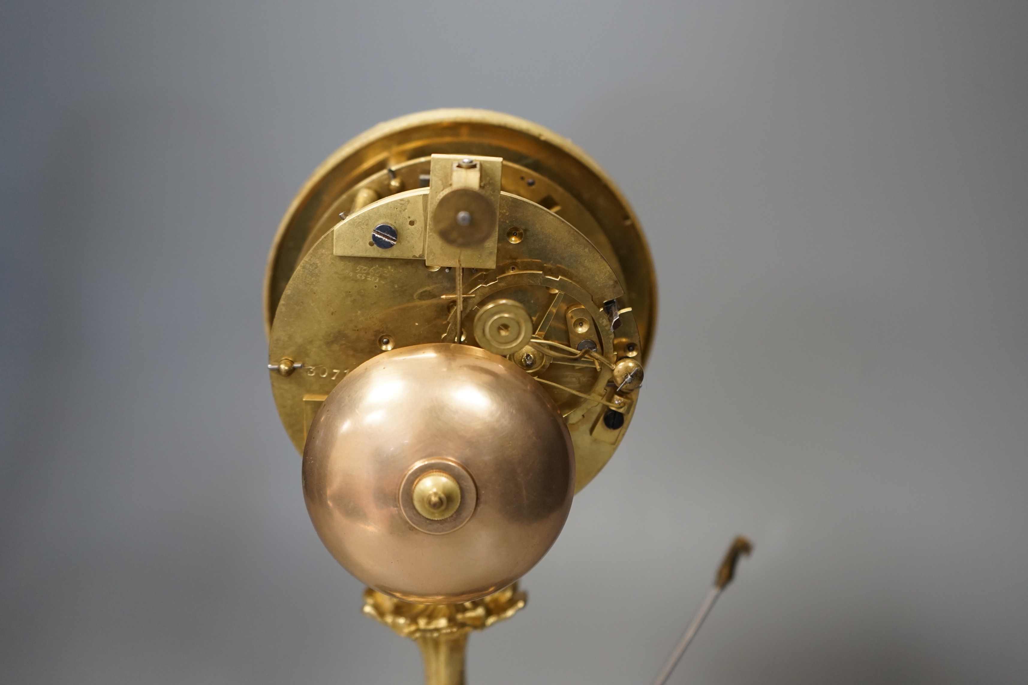 A French Grignon-Meusnier of Paris ormolu clock under dome, with key and pendulum